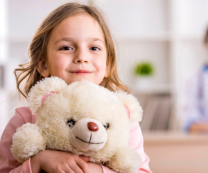 girl with toy in doctor's office